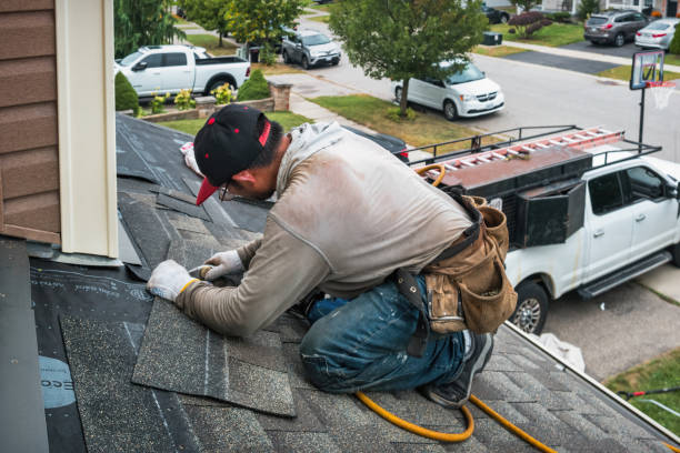 Professional Flat Roof Repair technician working in Smithville, MS